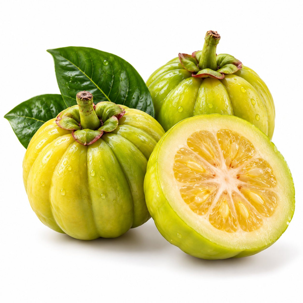 Garcinia cambogia fruit, whole and halved